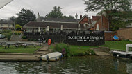 The St George Dragon Reading outside