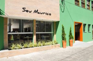 Seu Maurício outside