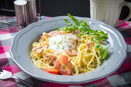 Spaghetti With Pounced Egg And Bacon