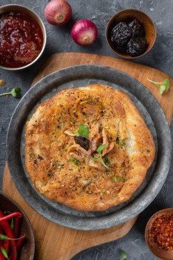 Mutton Achaari Kulcha Served With White Butter, Dal Makhani Tomato Murabba