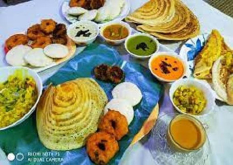 Jain Rava Masala Dosa, 1 Pc Idli, 2Pc Vadas With Sambar And Chutneys.