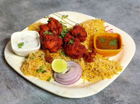 Chicken Lollipop (4 Pcs) Biryani Served With Raita And Salan