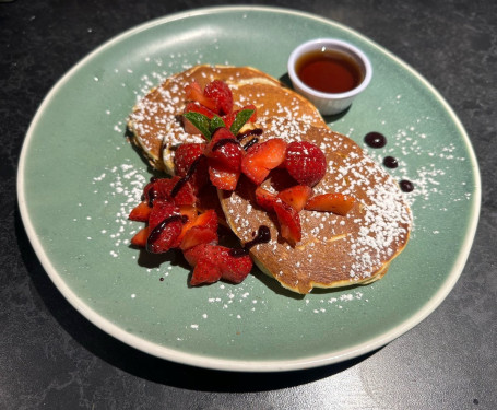 Pancake With Maple Syrup And Strawberries