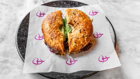 Bagel Of Oxtail Cooked In Red Wine, Secret Sauce, Bitter Leaves